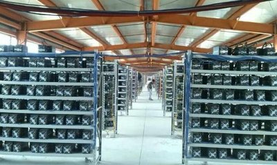 A mining farm with rows of mining rigs symbolizes the centralization and energy consumption of Bitcoin mining.